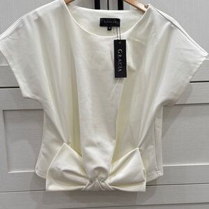 Never worn, new with tags! Cream cropped dress shirt with bow